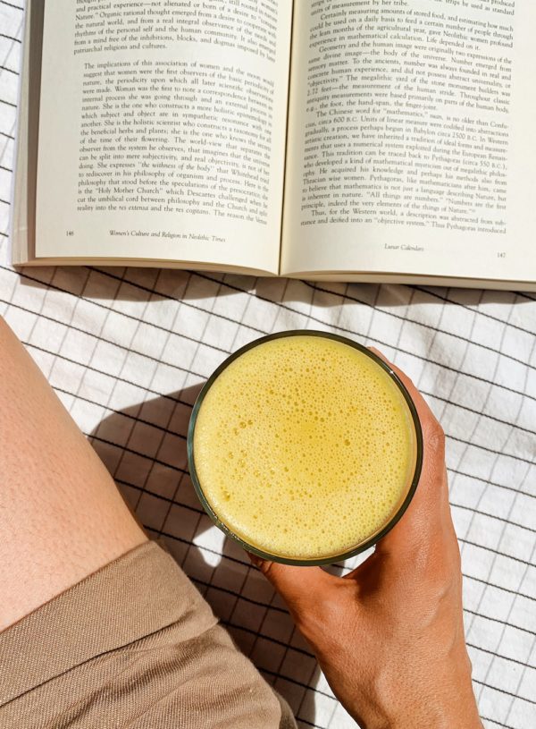 vegan orange julius drink with book