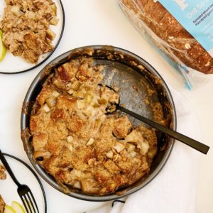 vegan bread pudding in baking dish with pears