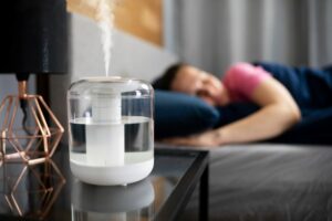 at home humidifier woman laying in bed dry skin