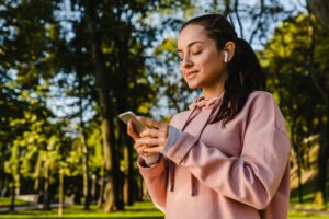 woman listening to music on a walk health rituals