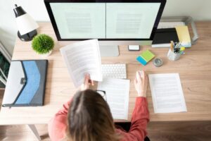 woman working at desk healthy habits