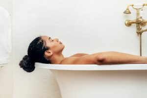 woman in relaxing bath to help wind down for sleep and bedtime