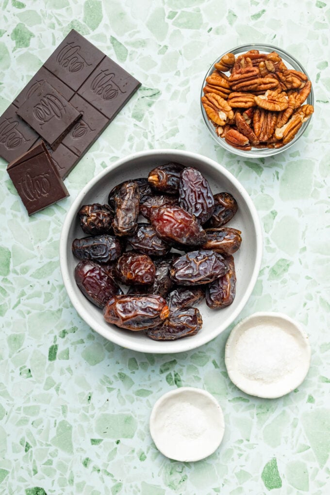 dates, chocolate and pecans in bowls