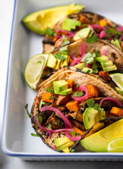 mushroom and sweet potato tacos with red onion and avocado.