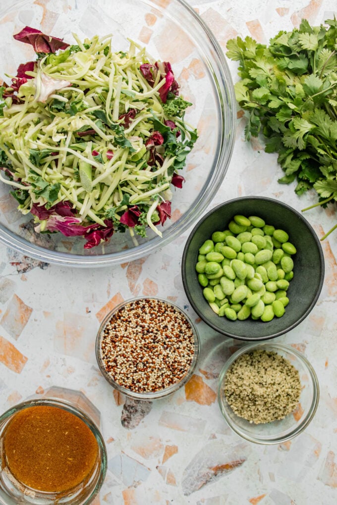 kale quinoa salad ingredients in bowls