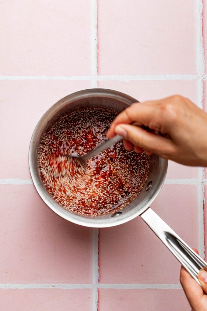 hand stirring chia jam