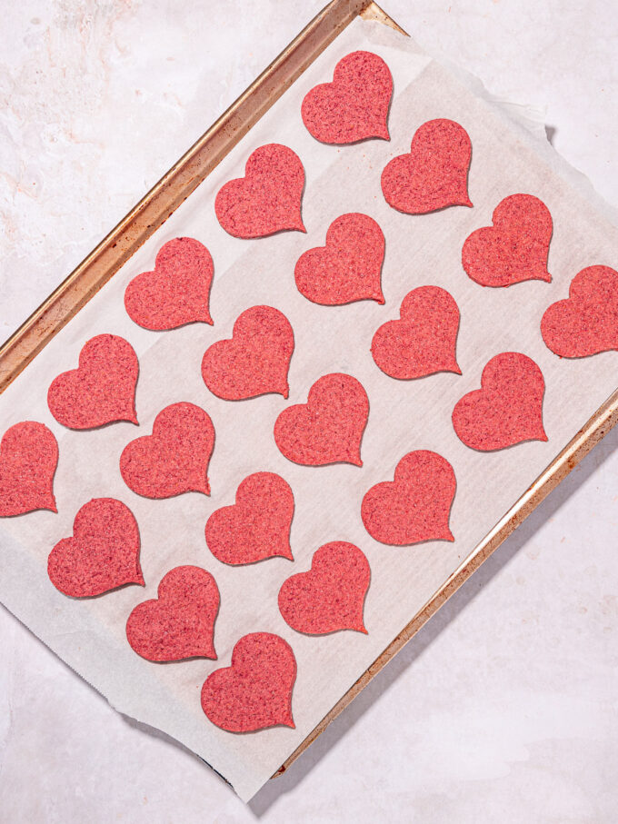 pink heart cookies on baking sheet