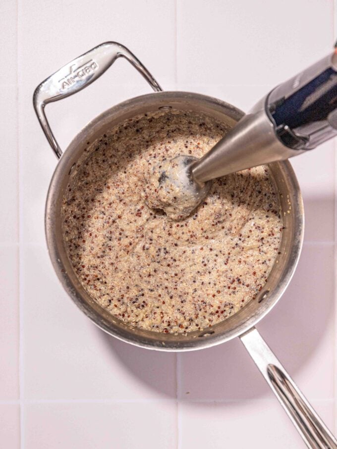 immersion blender in pot of quinoa