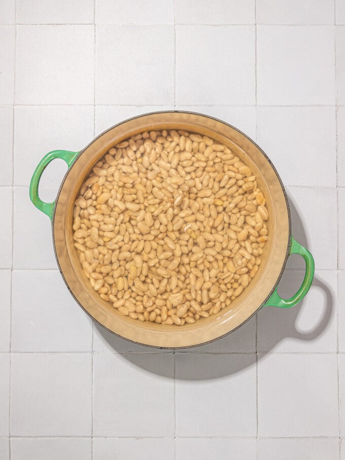 soaked white beans in green pot